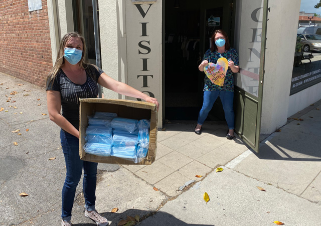 Beth Brennan, co-owner of Access Publishing delivers 1,000 surgical masks to Callie Lambeth of the Paso Robles Chamber of Commerce.